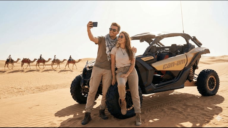 Couple taking selfie beside off-road buggy in desert with camel caravan in background